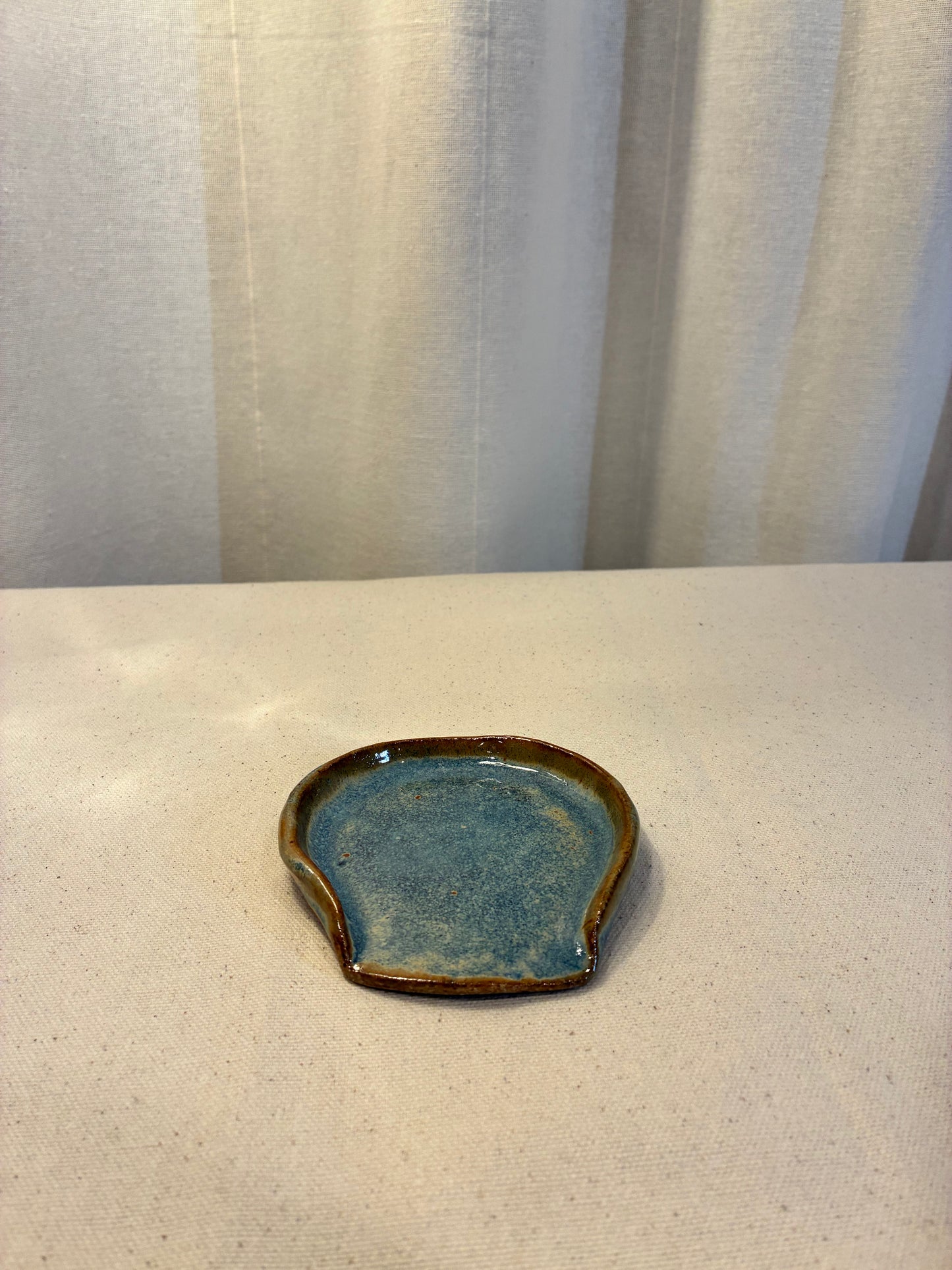 Small handmade, ceramic blue and brown spoon rest